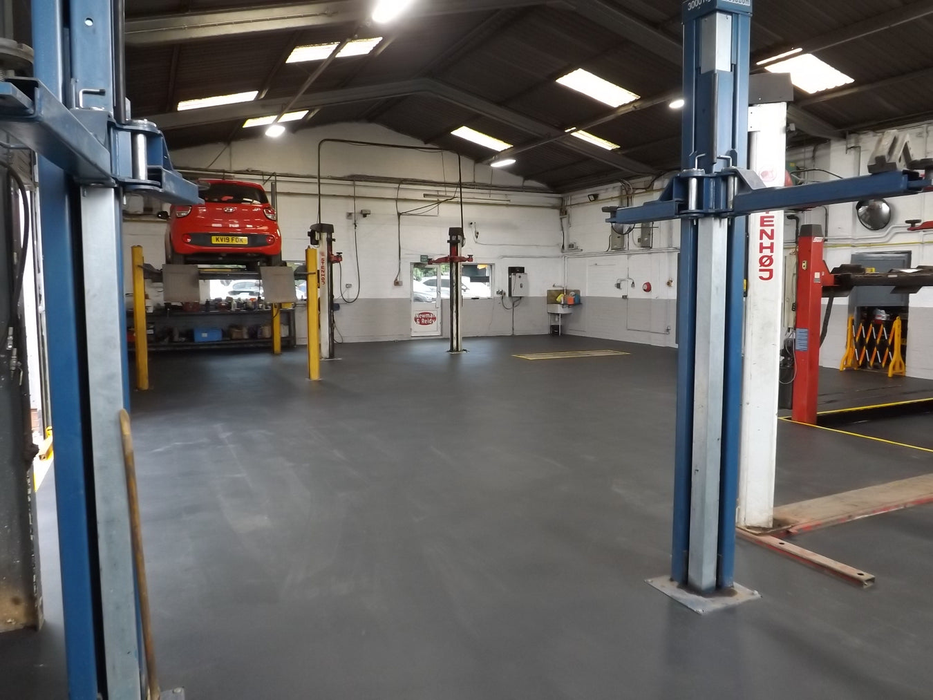 A garage with Ecotile Recycled Graphite Tiles